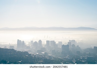 General view of cityscape with multiple modern buildings and skyscrapers in the foggy morning. skyline and urban architecture. - Powered by Shutterstock