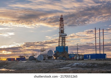 General View Of A Drilling Rig For Drilling Wells At An Oil And Gas Field In The Arctic Region. Drilling Equipment And Technical Infrastructure. Beautiful Sky