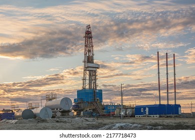 General View Of A Drilling Rig For Drilling Wells At An Oil And Gas Field In The Arctic Region. Drilling Equipment And Technical Infrastructure. Beautiful Sky