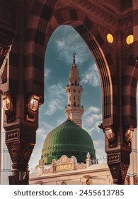 General view green dome and Moorish pattern arches of Nabawi mosque in Al Madinah, Kingdom of Saudi Arabia.