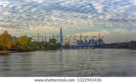 General view of Srednyaya (Middle) Nevka river shoreline, embankment architecture and Lakhta-center at far background. Saint-Petersburg, Russia.