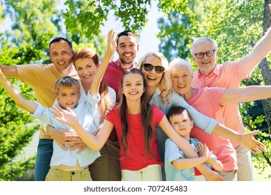 generation and people concept - happy family portrait in summer garden
