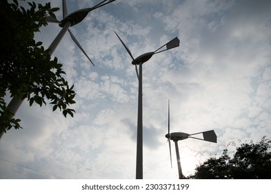Generation wind turbines under a cloudy sky 1