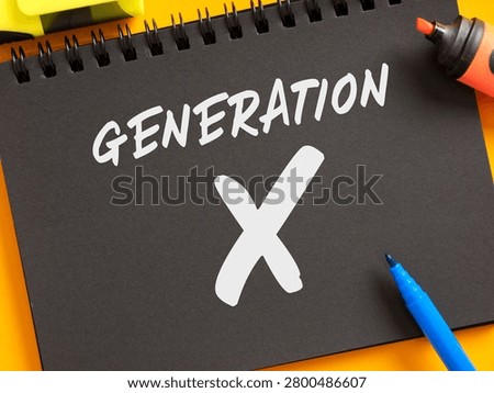Generation X concept on a black spiral notebook with markers, representing the social cohort and demographic group