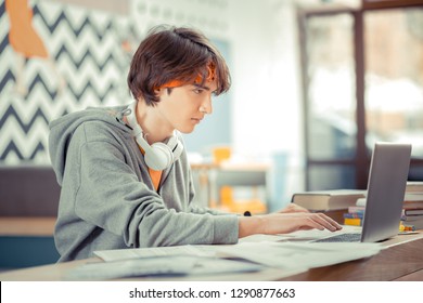 Generation Z. The Teenager Doing His Hometask Using The Computer