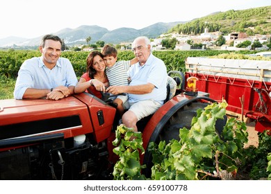 Generational Family Sitting On Tractor