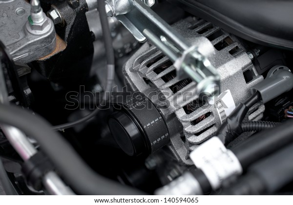 Generator and fan belt in a\
car engine