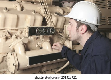 A Generator  In A Hospital With A Repair Men.