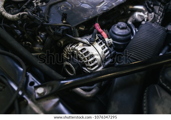 generator under the hood of\
the car\
