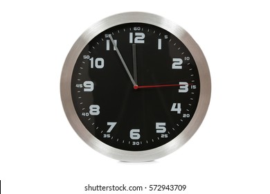 Generic black and silver wall clock showing at the eleventh hour on a white background