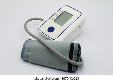 Generic Blood Pressure (BP) Monitor And Cuff On A White Back Ground.