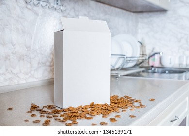 Generic box of cereals on the kitchen table. White package of ready breakfast in home background
