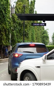 Generic Drive Thru Pickup Point With Cars Waiting In Line