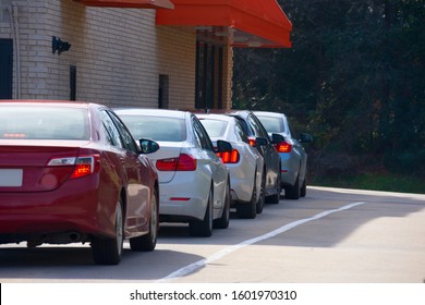 Generic Drive Thru Pickup Window With Cars Waiting In Line To Get Their Products Or Food.