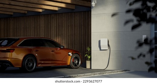 Generic electric vehicle EV hybrid car is being charged from a wallbox on a contemporary modern residential building house - Shutterstock ID 2293627077