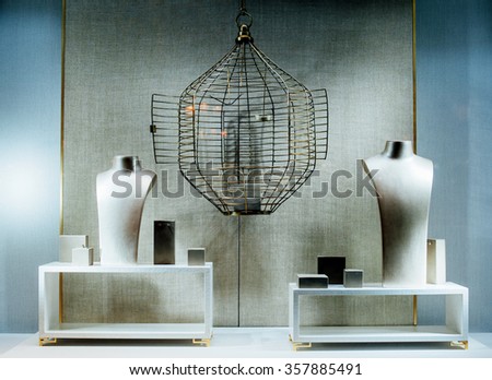 Generic empty jewelry store show-window with a two dummy torso, an empty cage and no gems or gold