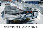 Generic EV Battery Pack on Electric Car Production Line inside Modern Factory. High Capacity Battery for Automotive Industry. Lithium-ion High-voltage Battery for Electric Vehicle or Hybrid Car.