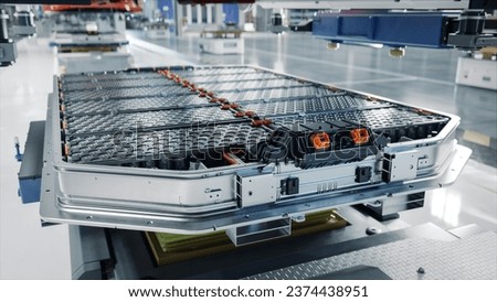Generic EV Battery Pack on Electric Car Production Line inside Modern Factory. High Capacity Battery for Automotive Industry. Lithium-ion High-voltage Battery for Electric Vehicle or Hybrid Car.