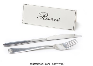 Generic Reserved Sign In French With Fork And Knife On White Background