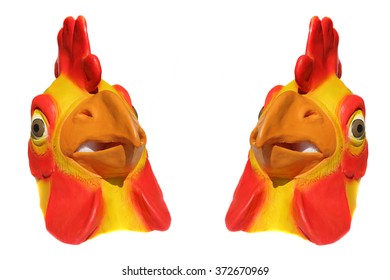 Generic Rubber Yellow And Red Chicken Head Mask. Isolated On White With Room For Your Text.