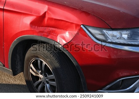 Generic SUV with dented front side. Minor accident result - fender bender.