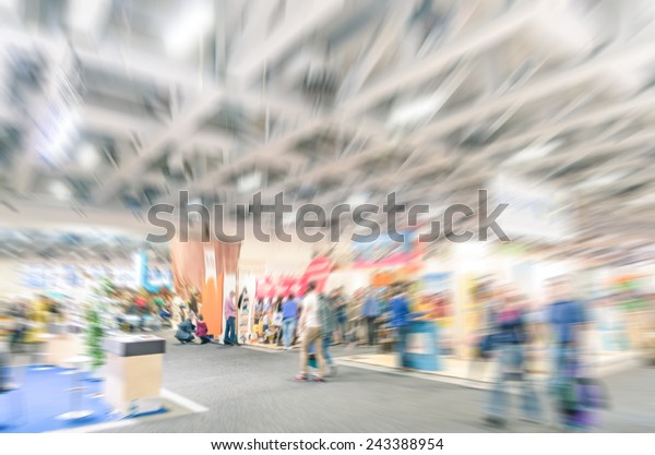 Generic trade show stand with blurred zoom\
defocusing - Concept of business social gathering for international\
meeting exchange