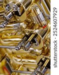 Generic valved brass musical instrument. Close up shot, abstract musical industry background.