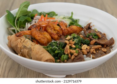 Generous Bowl Of Vermicelli Salad, Full Of Shrimp, Beef, And Egg Roll For A Vietnamese Meal.