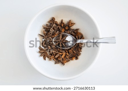 A generous heap of raw whole star anise, an aromatic kitchen spice.