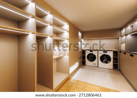 Generously sized laundry area with organized storage solutions