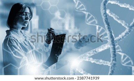 Geneticist woman. Girl is scientist near DNA chains. Geneticist with test tube and tablet. Girl is doing genetic research. DNA sequencing in laboratory. Woman geneticist in white coat