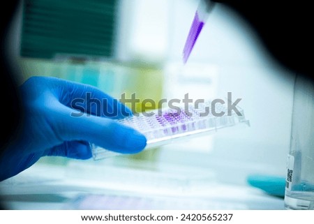 Similar – Image, Stock Photo Laboratory worker pipetting with pipette