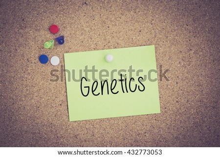 Genetics written on sticky note pinned on pinboard