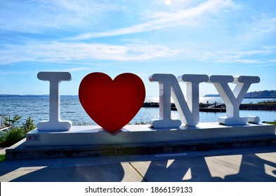 Geneva, New York, US- November 7, 2020:  Sign of ‘I LOVE NEW YORK’ standing on Seneca Lake, one of Finger Lakes in New York. Tourism region 
