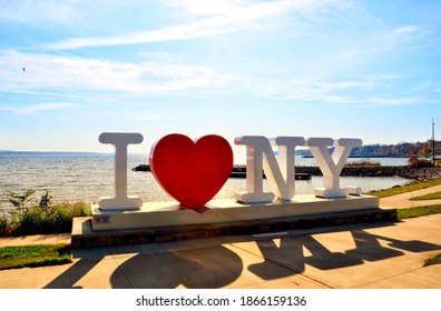 Geneva, New York, US- November 7, 2020:  Sign of ‘I LOVE NEW YORK’ standing on Seneca Lake, one of Finger Lakes in New York. Tourism region.