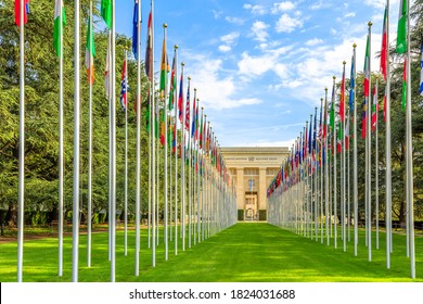 Geneva, Switzerland - Aug 16, 2020: Row of flags at entrance of United Nations Offices or Palais des Nations in Ariana Park, on shore of Lake Geneva. Since 1966 is main European headquarters of UN.