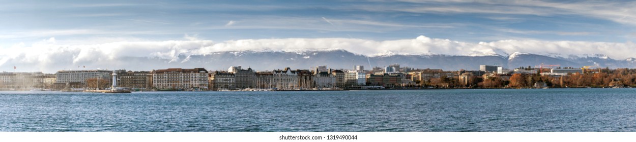 GENEVA, SWITZERLAND - JANUARY 26, 2019: View On Geneva Lake From Quai De Cologny With Phare Des Paquis On The Left, Geneva, Switzerland. Lake On The North Side Of The Alps, Shared Betwe