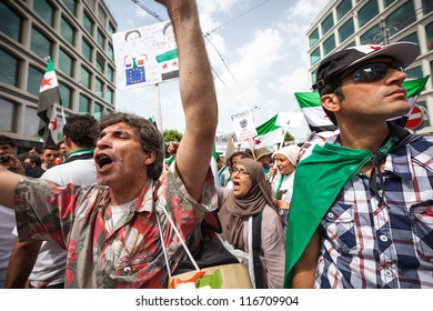 GENEVA, SWITZERLAND - JUNE 30: Unidentified protesters during a protest against President of Syria Bashar al Asaad in the center of the city of Geneva, June 30, 2012 in Geneva, Switzerland.