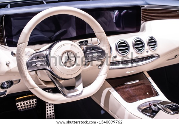 Geneva, Switzerland, March 05, 2019: inside Mercedes\
Benz S 560 4Matic Cabriolet at Geneva International Motor Show,\
produced by Mercedes-Benz, control board, steering wheel,\
upholstery, seats, 
