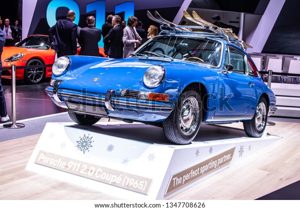 Geneva, Switzerland, March
05, 2019: vintage blue Porsche 911 2.0 Coupe 1965 glossy and shiny
old classic retro car at Geneva International Motor Show, Porsche
Museum,