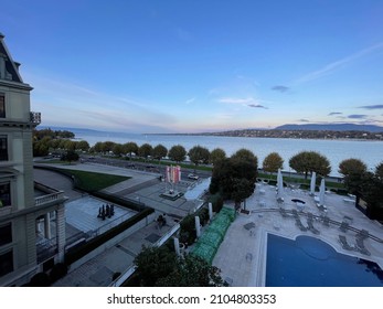 Geneva, Switzerland - October 27 2021: View over the Lac Leman lake and the waterfront swimming pool of Hotel President Wilson
