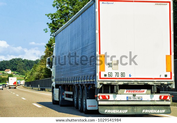 Geneva, Switzerland - September 1,\
2016: Truck on the roadway in Canton Geneva in\
Switzerland.