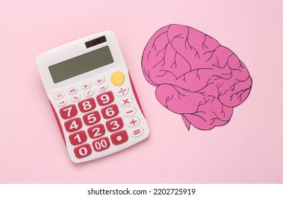 Genius Concept, Child Prodigy. Calculator And Brain On Pink Background