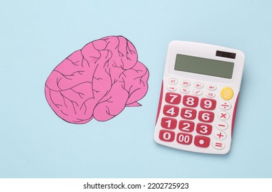 Genius Concept, Child Prodigy. Calculator And Brain On Blue Background