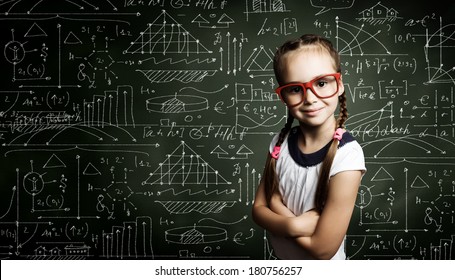 Genius Girl In Red Glasses Near Blackboard With Formulas