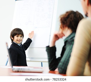 Genius Kid On Business Presentation Speaking To Adults And Giving Them A Lecture