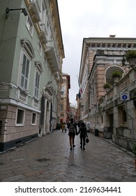 Genoa, Italy - April 24, 2022: A Couple Walking In Garibaldi Street, Strada Nuova, With The Rich Facades Of The Genoese Palaces Called Rolli, Unesco World Heritage 