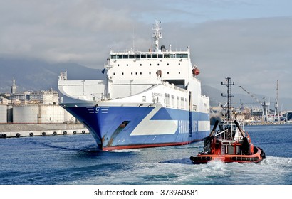 GENOA, ITALY - FEBRUARY 5, 2016: Eurocargo Livorno Is A RoRo Ferry Cargo Company Inarme The Grimaldi Group, Built In Hyundai Mipo Shipyard In Ulsan, South Korea. The Ship Enters The Port. 