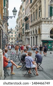 Genoa , Italy - July 7, 2019: Rerspective Of San Lorenzo Street In Genoa With People At Cafe