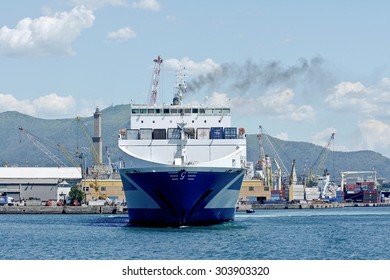 GENOA, ITALY - JUNE 15, 2014: Eurocargo Malta Is A RoRo Ferry Cargo Company Inarme The Grimaldi Group, Built In Hyundai Mipo Shipyard In Ulsan, South Korea.
The Ship Enters The Port. 